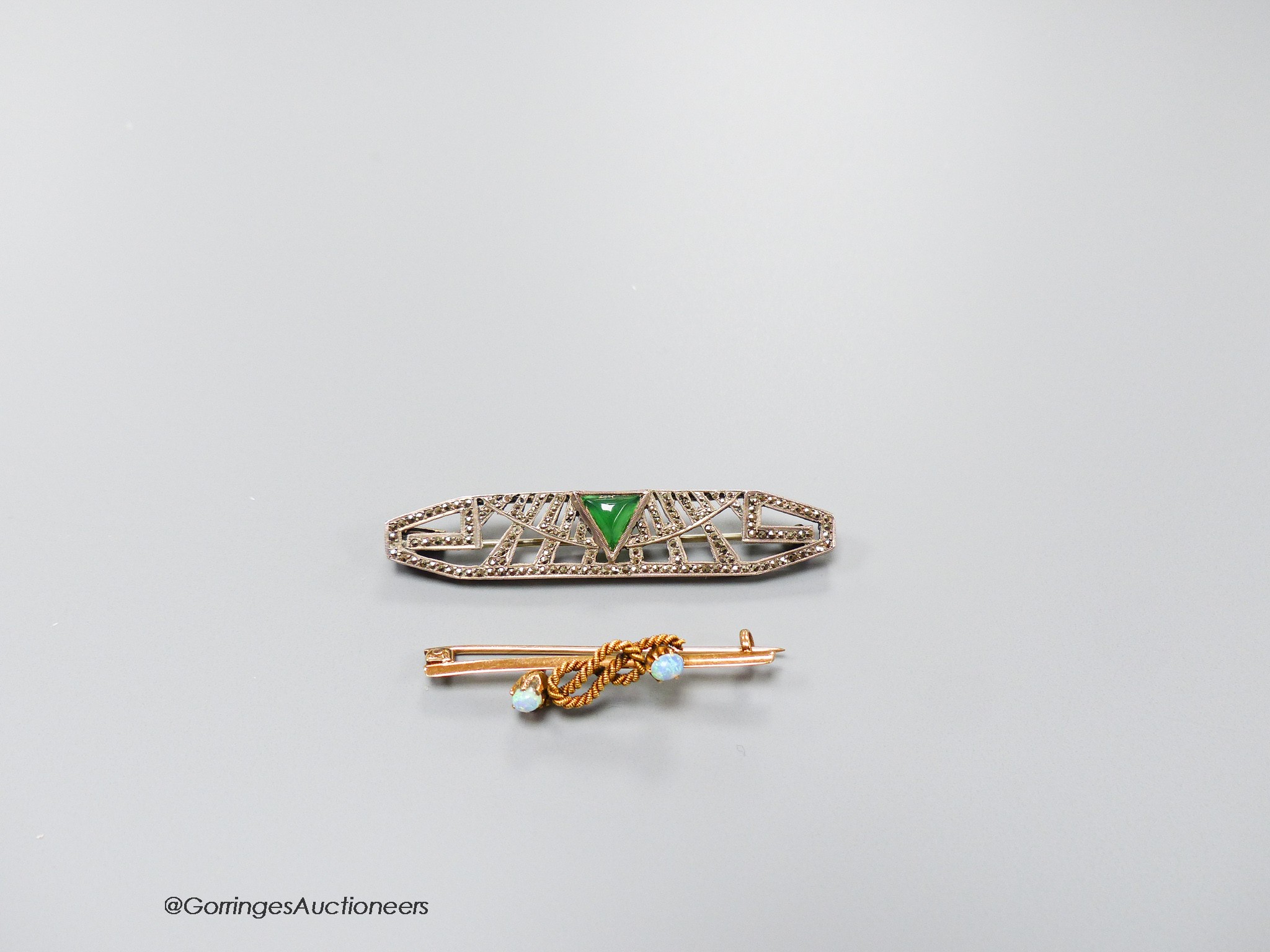 A yellow metal and two stone opal set ropetwist bar brooch, 42mm, gross 3.4 grams and a French Art Deco, chrysoprase and marcasite set bar brooch.